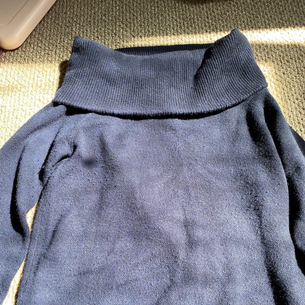 Navy sweater off the shoulders